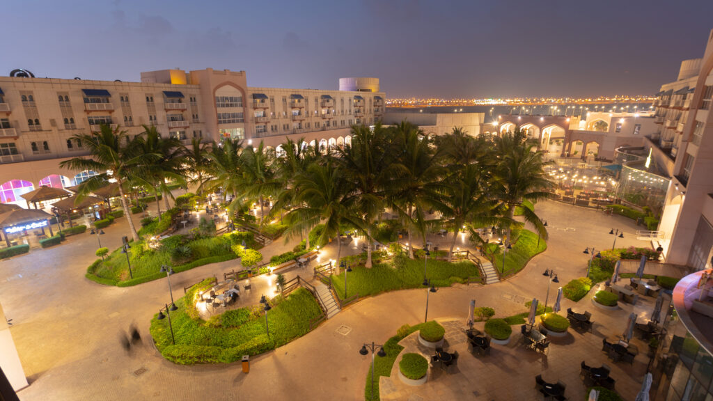 Modern interior of Salalah Gardens Mall with shops and cafés