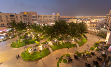 Modern interior of Salalah Gardens Mall with shops and cafés