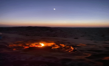 Desert sunset seating around fire Salalah Desert Safari