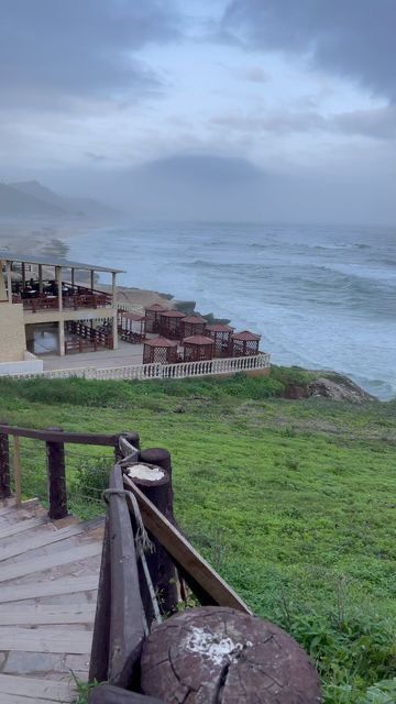 Waves crashing through natural blowholes at Mughsail Beach in Salalah
