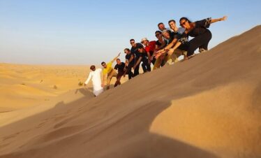 Group exploring sand dunes in Rub Al Khali