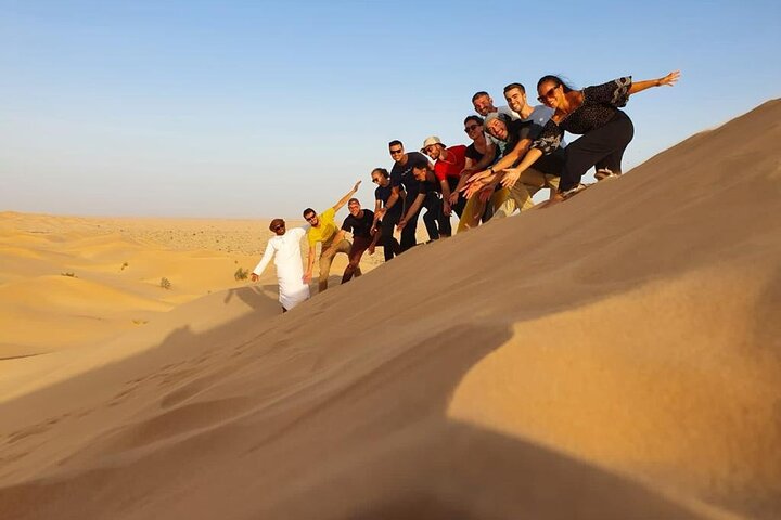 Group exploring sand dunes in Rub Al Khali