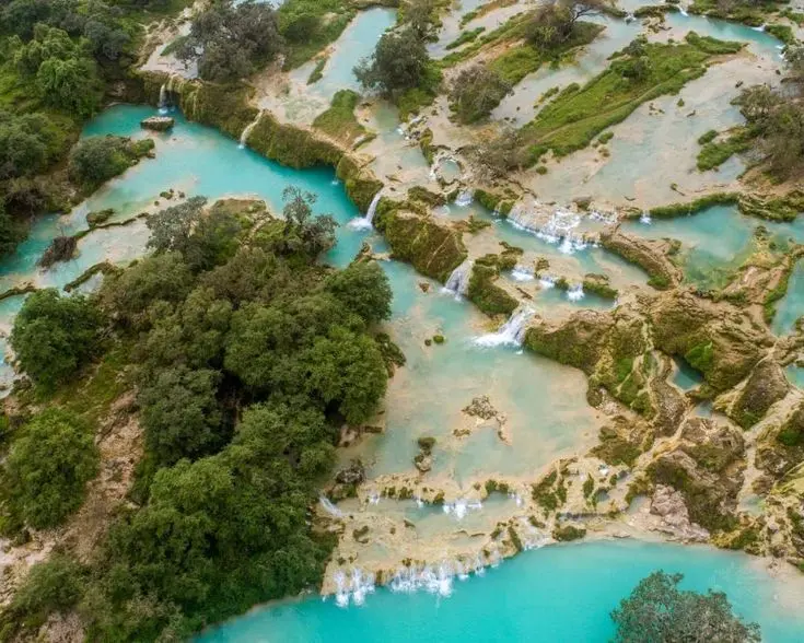 Scenic view of Wadi Darbat waterfall during Khareef season in Salalah