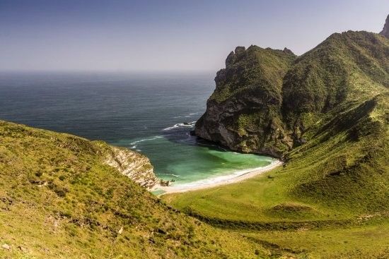 Secluded beach in West Salalah with white sand and blue waters