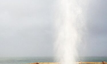 Close-up of water jet spraying from a blowhole at Mughsail Beach