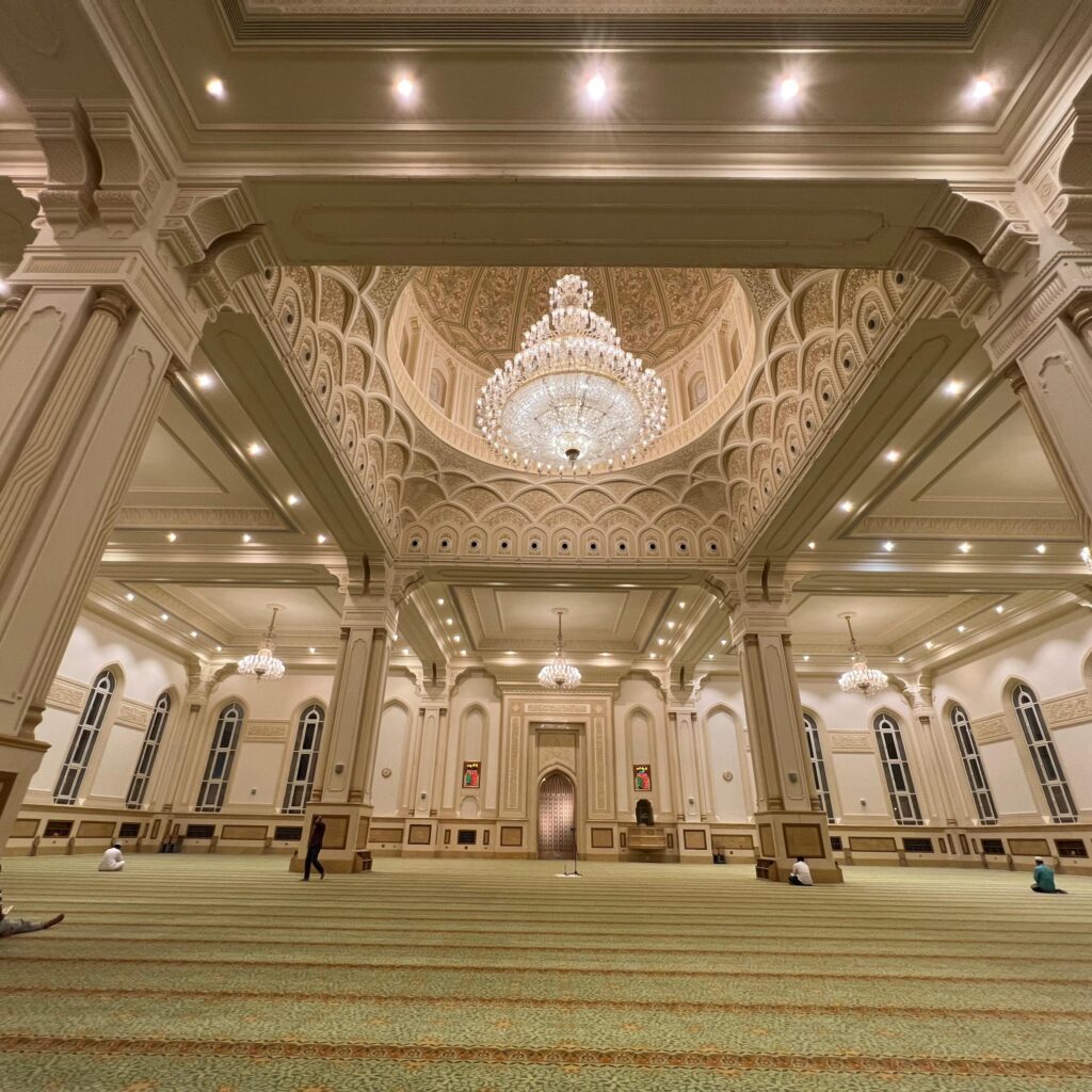Sultan Qaboos Mosque in Salalah with golden domes and white marble design