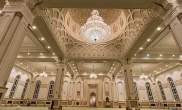 Sultan Qaboos Mosque in Salalah with golden domes and white marble design