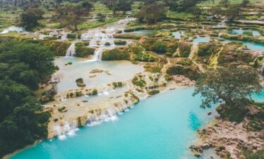 Scenic view of Wadi Darbat waterfalls and wildlife on East Salalah day trip