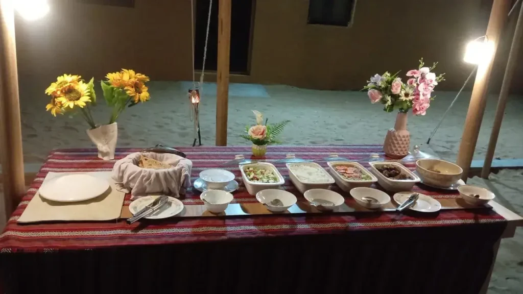 traditional Omani dinner served in Empty Quarter desert camp