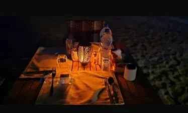 enjoying dinner in Rub Al Khali desert camp