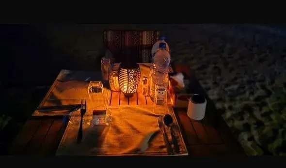 enjoying dinner in Rub Al Khali desert camp